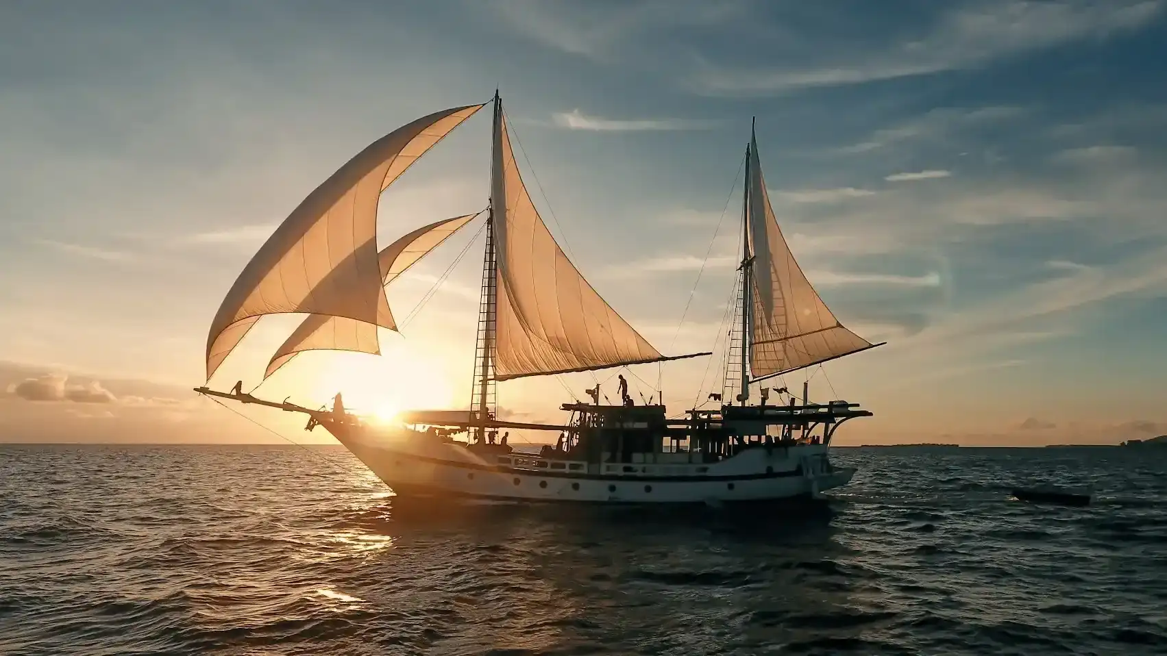 A liveaboard at anchor at sunset in Indonesia